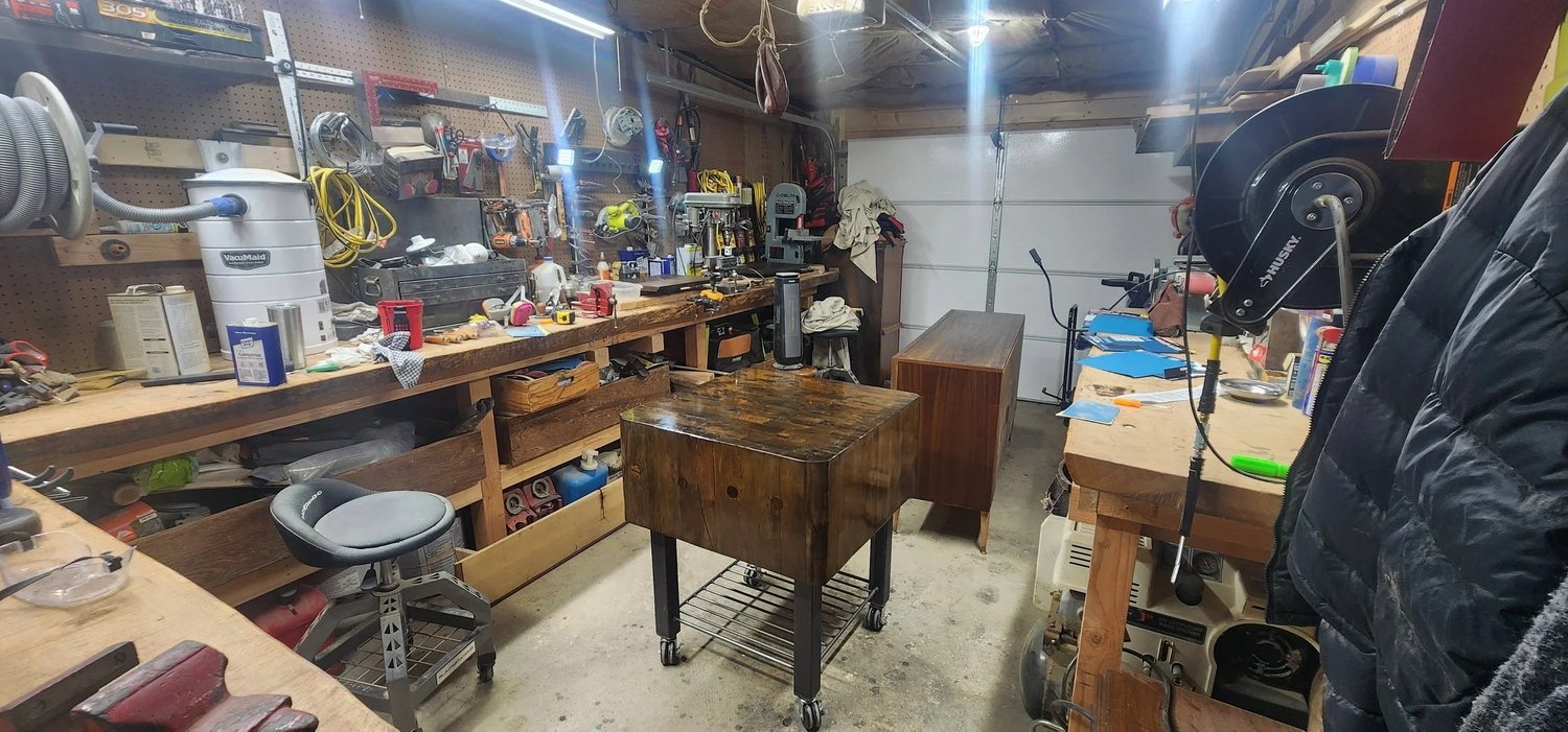 Restored maple butcher block kitchen island in shop setting