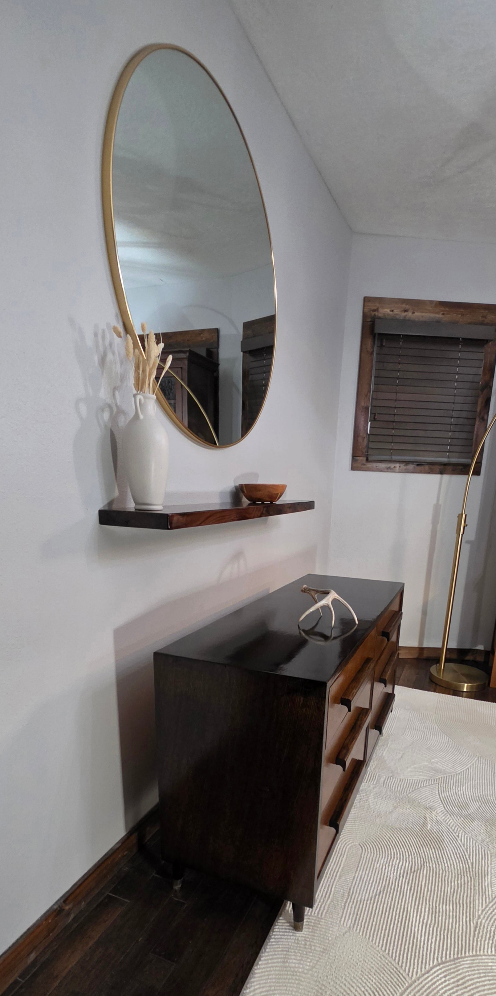Mid-century modern dresser with floating shelf and antlers