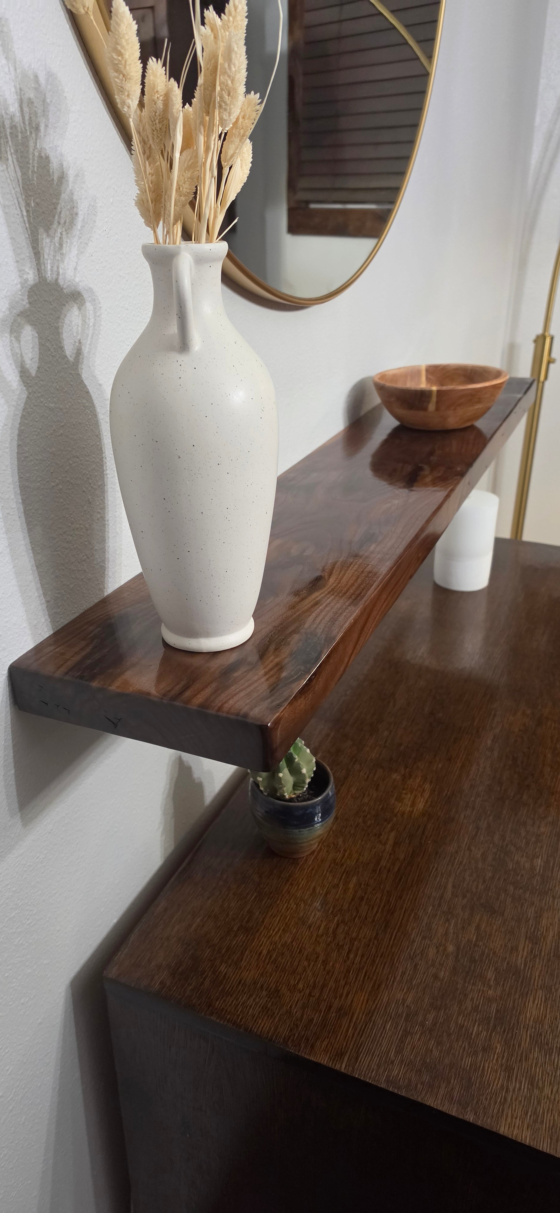 Solid walnut floating shelf finsiehd with Waterlox in Great Falls Montana