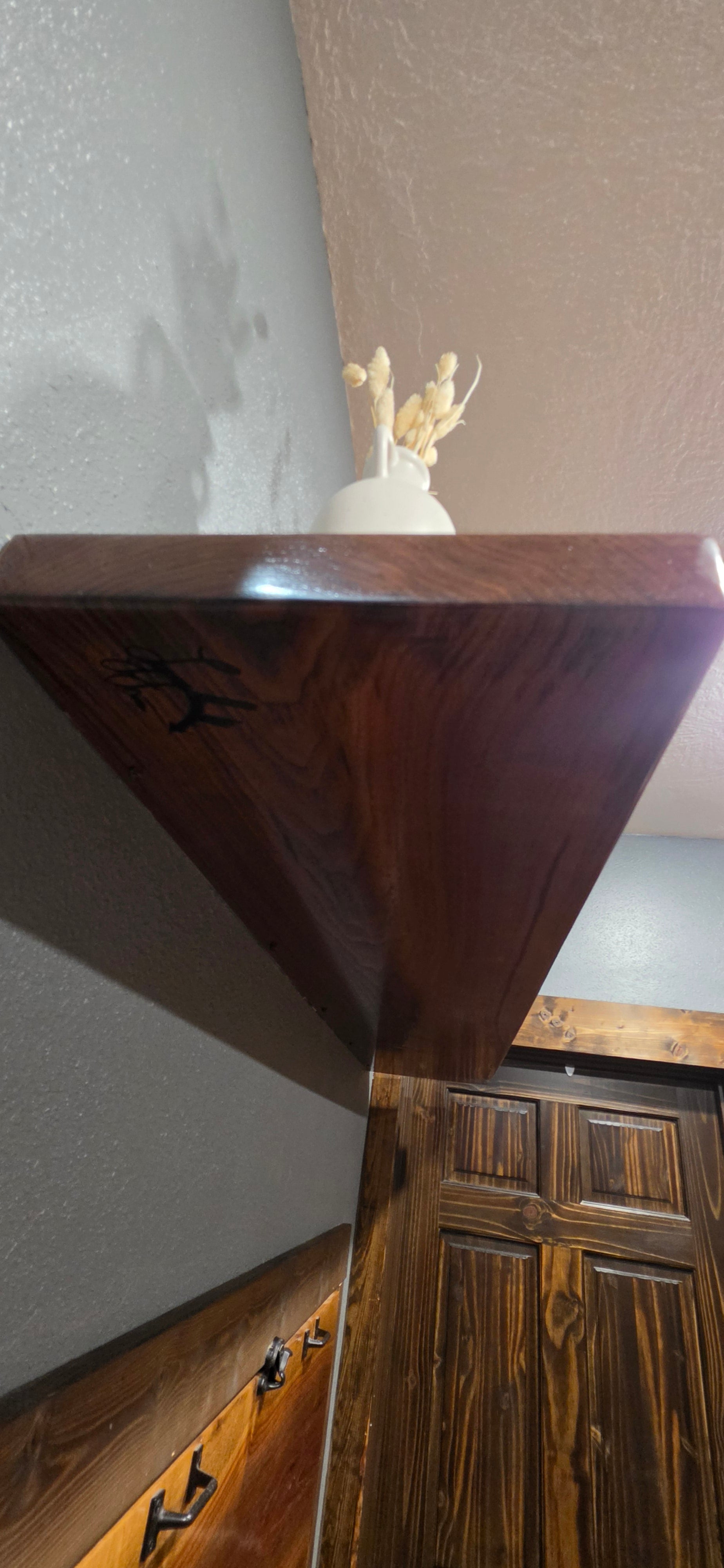 Thick walnut floating shelf with naturual grain and character