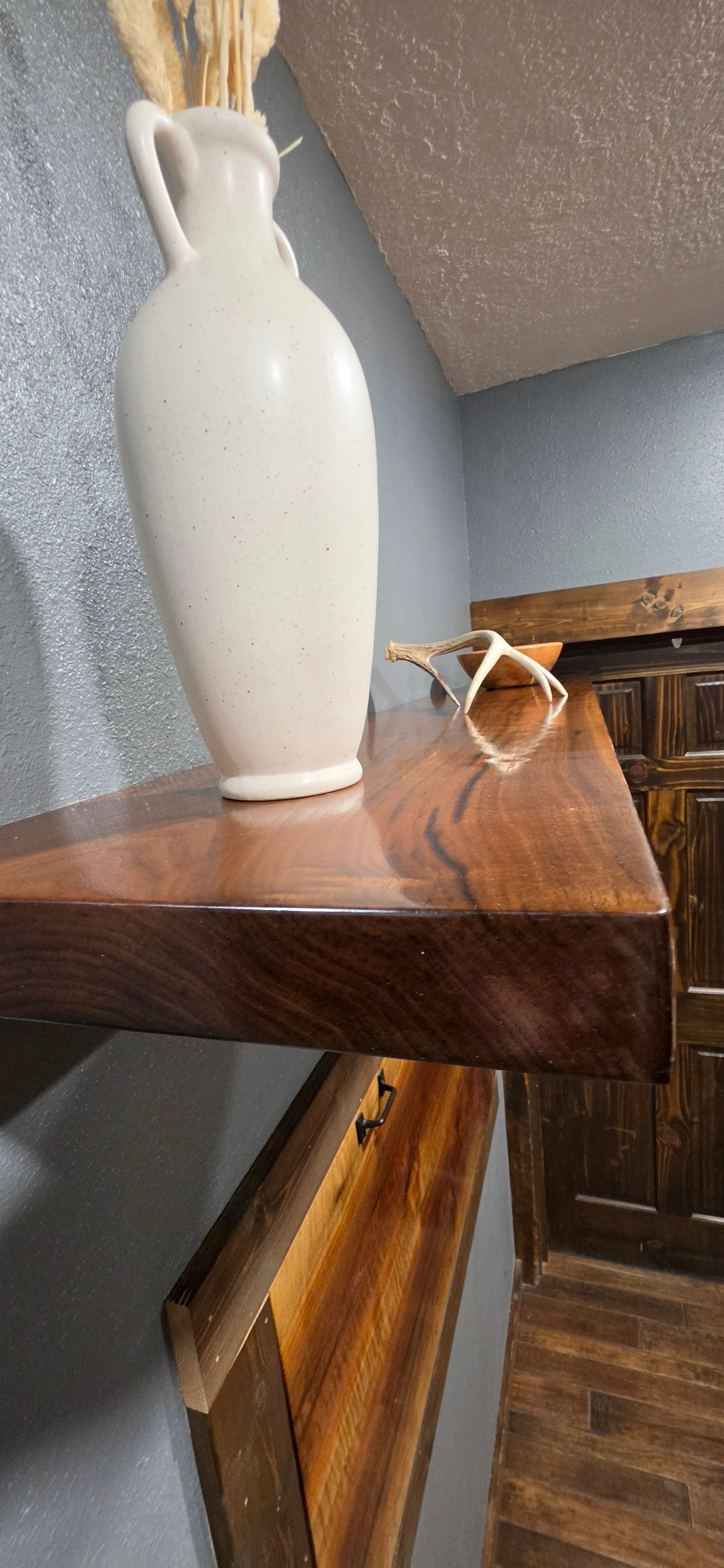 Premium walnut floating shelf installed in Great Falls, MT