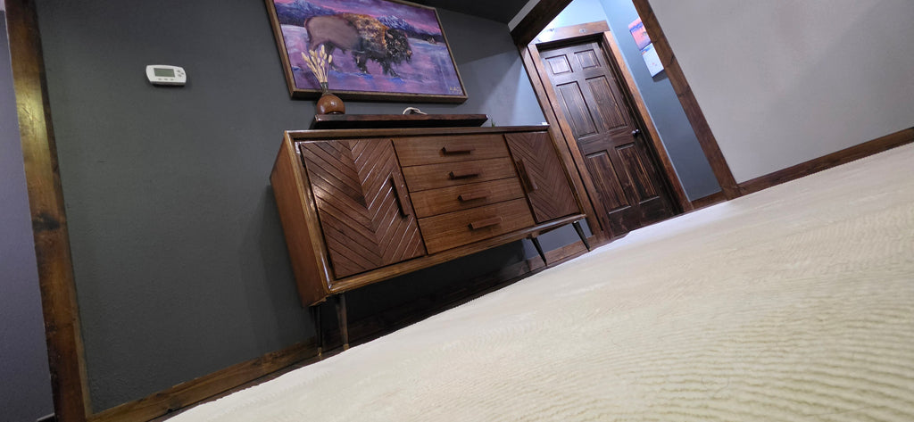 Custom walnut credenza with floathing shelf and buffalo painting