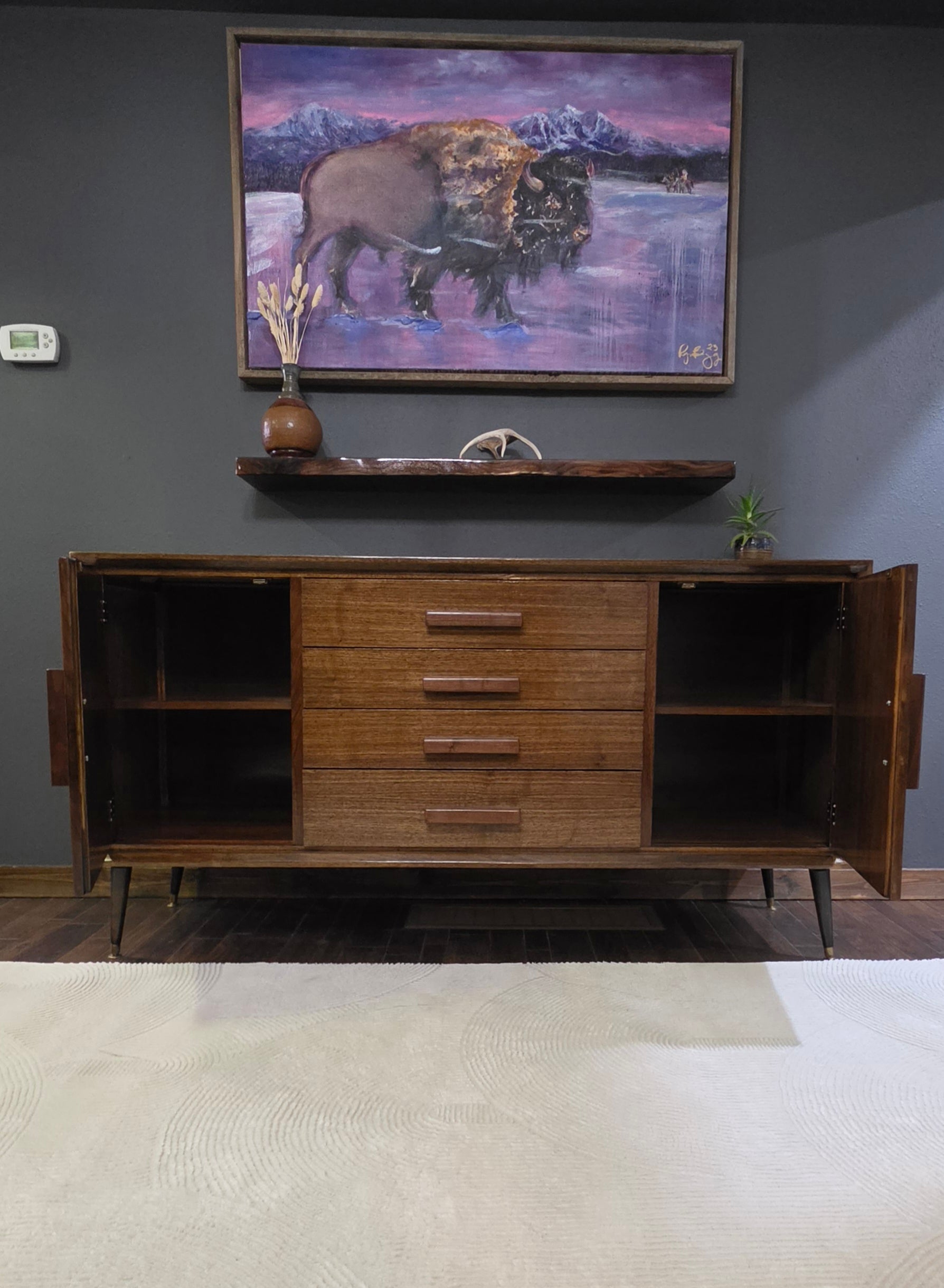 Custom walnut mid century resoration with walnut floating shelf and doors open